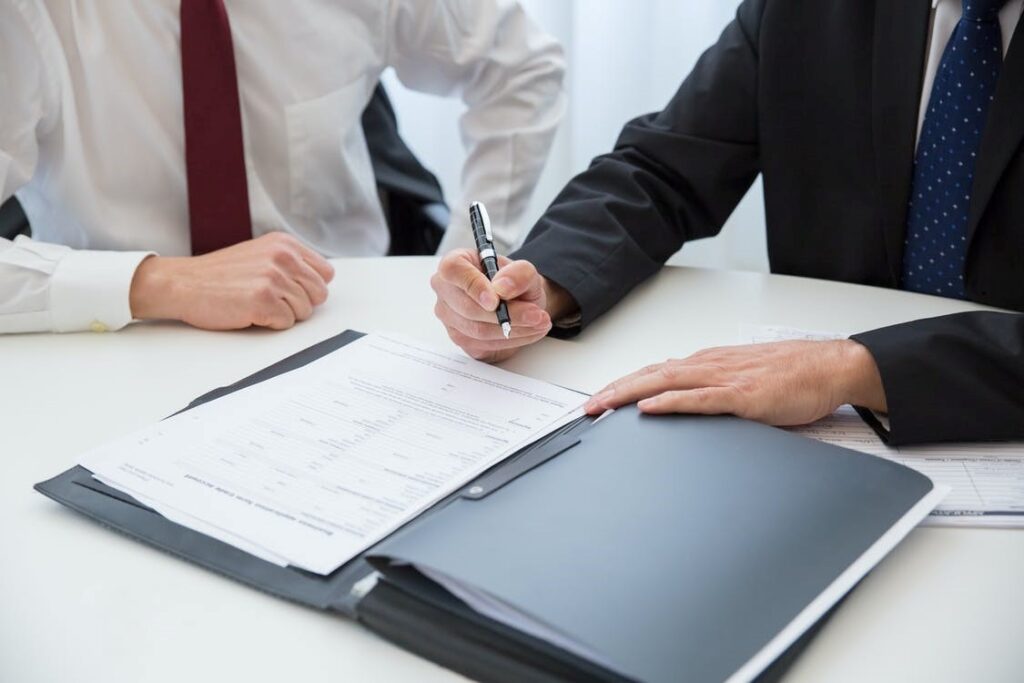 Trademark attorney explaining adverse report objections to a business owner